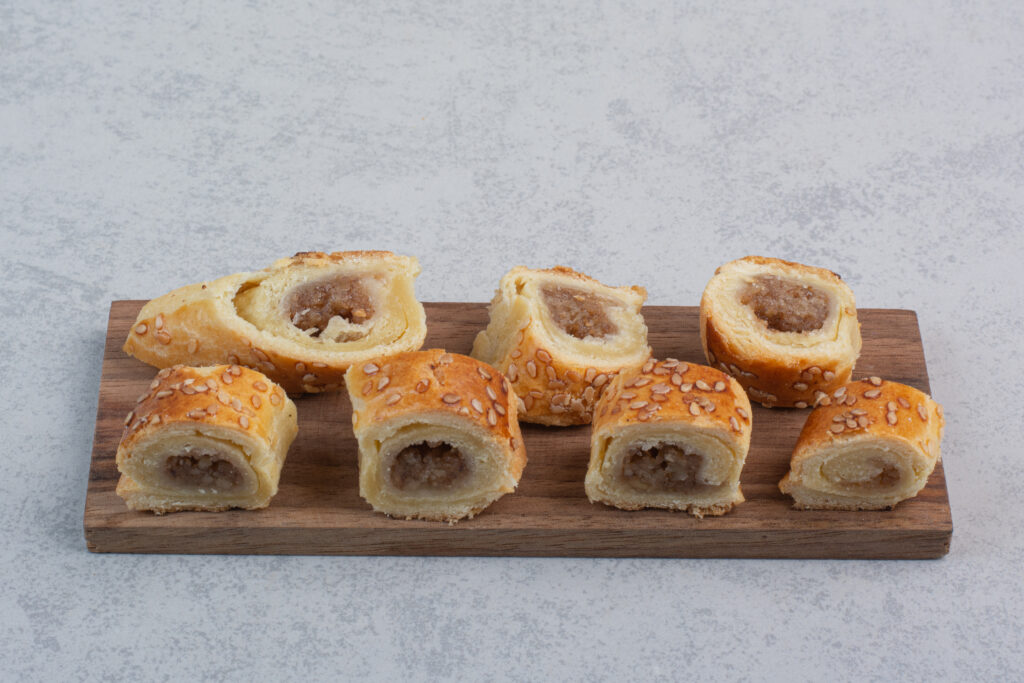 bunch sweet cookies wooden plate